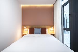 Łóżko lub łóżka w pokoju w obiekcie Vallecas Suites by Olala Homes