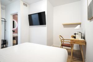 Łóżko lub łóżka w pokoju w obiekcie Vallecas Suites by Olala Homes