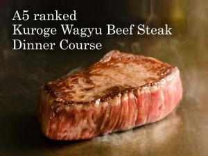 a piece of beef steak sitting on a table at Granbell Hotel Osaka in Osaka