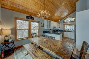 a kitchen and dining room with a wooden table at Heaven by the Lake in Truckee