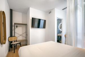 Łóżko lub łóżka w pokoju w obiekcie Vallecas Suites by Olala Homes
