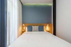 Łóżko lub łóżka w pokoju w obiekcie Vallecas Suites by Olala Homes