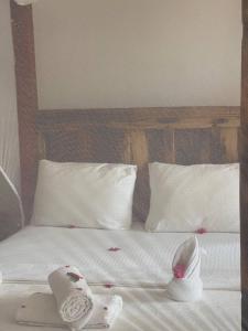 Ein Bett oder Betten in einem Zimmer der Unterkunft Babalao Bungalows