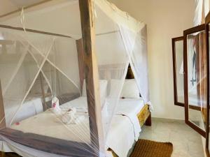 Ein Bett oder Betten in einem Zimmer der Unterkunft Babalao Bungalows