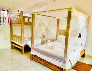 Ein Bett oder Betten in einem Zimmer der Unterkunft Babalao Bungalows