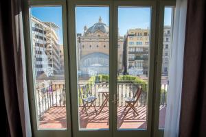a view of a city from a window at Petit Palace Museum in Barcelona +48 photos