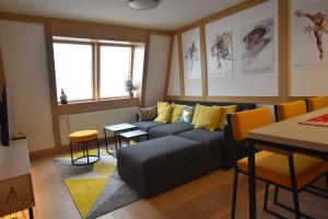 a living room with a couch and a table at Splendid View Place in Jahorina