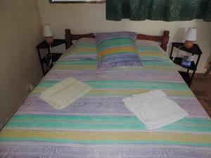 Cama o camas de una habitación en Alizes Bungalows