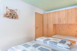 Кровать или кровати в номере Huterhof Apt Talblick