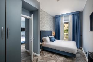 Voodi või voodid majutusasutuse Bloom Hotel Rome toas