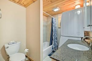a bathroom with a toilet and a sink and a tub at West Dover Home with Deck about 2 Mi to Mount Snow! in West Dover +31 photos