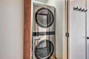 two washer and dryer machines in a room at Renovated Fort White Retreat with River Access! in Fort White
