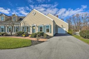 a house with a driveway in front of it at Chateau Ridge Peaceful Retreat with Fire Pit! in Westminster