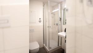 Koupelna v ubytování Hotel Garni Fischerfleck in Ismaning near Munich