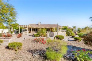 a house with a garden in front of it at Camino Casa in Indio