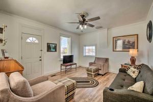 a living room with two couches and a tv at Kik-N-Bak Cottage with Beautiful Mountain View in Manti