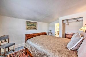 a bedroom with a bed and a chair at Kik-N-Bak Cottage with Beautiful Mountain View in Manti