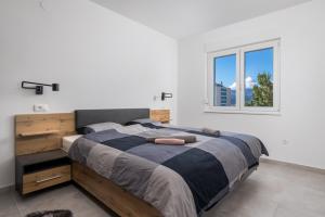 Llit o llits en una habitació de Apartman Arba