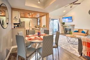 a dining room and living room with a table and chairs at Serene Condo Near Park City Resort! in Park City