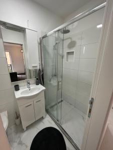 a bathroom with a shower and a sink at Lena 2 in Jajce