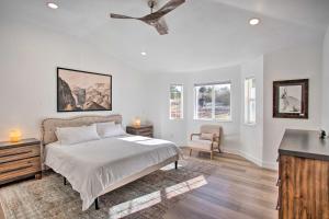 a bedroom with a bed and a ceiling fan at Grand Junction Retreat Near National Monument! in Grand Junction