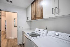 a white laundry room with a washer and dryer at Grand Junction Retreat Near National Monument! in Grand Junction