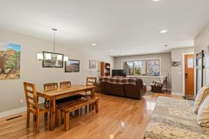 a living room with a table and a couch at Durango Deluxe Townhome in Durango
