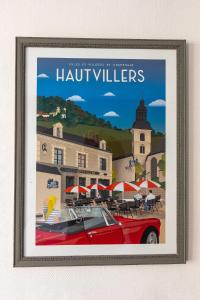 a poster of a red car parked in front of a beach at Joli T2 rénové 'Pinot Noir' plein centre village in Hautvillers