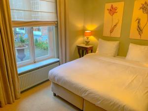 Postel nebo postele na pokoji v ubytování Hotel Beijers