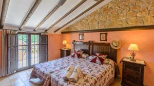Posteľ alebo postele v izbe v ubytovaní Combinación Cortijo y Mirador Casablanca Priego de Córdoba by Ruralidays
