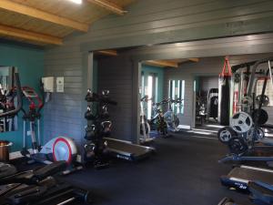 a gym with several treadmills and bikes in it at Shepherds Hut, Hannahs Retreat, Bowness-on-Solway in Bowness-on-Solway