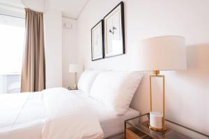 Ένα ή περισσότερα κρεβάτια σε δωμάτιο στο Executive Suite w/ Rooftop Pool +7 φωτογραφίες