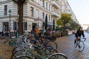 a row of bikes parked on a street in front of a building at LivingKreuzberg - Stilvolle Altbauwohnung in Berlin