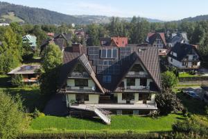 an aerial view of a house with solar panels on its roof at Willa na Wierszykach 1 in Zakopane