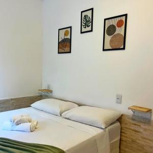 מיטה או מיטות בחדר ב-Pousada Nossa Senhora D'Ajuda