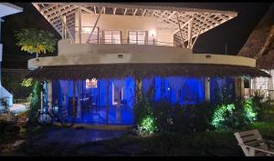 een huis met blauwe lichten ervoor bij Park Marine Estate II in Malindi