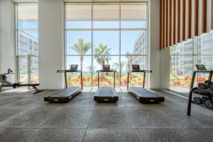 a gym with a row of treadmills at Suite 107 - Two bedroom apartment in Funchal
