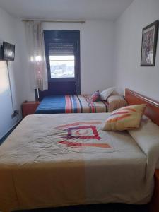 A bed or beds in a room at Deltebre Riu Még 14 kép