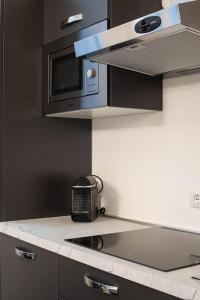 A kitchen or kitchenette at IM Apartments - Appartamento in zona Piazza Repubblica - Centrale