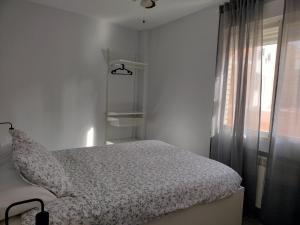 Łóżko lub łóżka w pokoju w obiekcie Alojamiento Turístico Las Cigüeñas