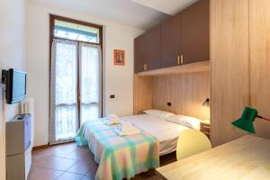 Ένα ή περισσότερα κρεβάτια σε δωμάτιο στο Parma Historic Center Apartment 7min from Duomo