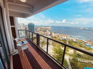 a balcony with a view of the water at R&F Princess Cove Johor Bahru By SShineHome in Johor Bahru