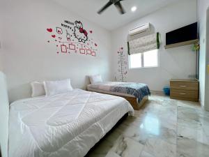 Postel nebo postele na pokoji v ubytování Ks Homestay