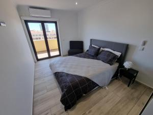 Postel nebo postele na pokoji v ubytování Apartamento com terraço e vistas