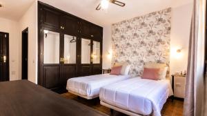 Postel nebo postele na pokoji v ubytování Hotel Ecolife Tenerife