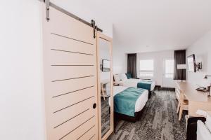 Postel nebo postele na pokoji v ubytování La Place Rendez-Vous Hotel