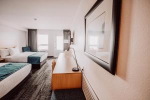 Postel nebo postele na pokoji v ubytování La Place Rendez-Vous Hotel