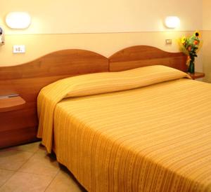 Postel nebo postele na pokoji v ubytování Albergo Aurora