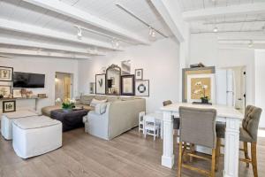 a living room with a couch and a table at Ocean Views, Across The Street From Beach, Private Patio in Carlsbad