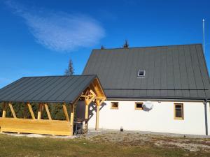 a large white building with a black roof at CASA SMIDA JAZZ in Smida